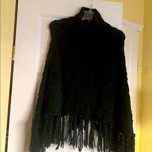Poncho sweater with fringe bottom mock neck